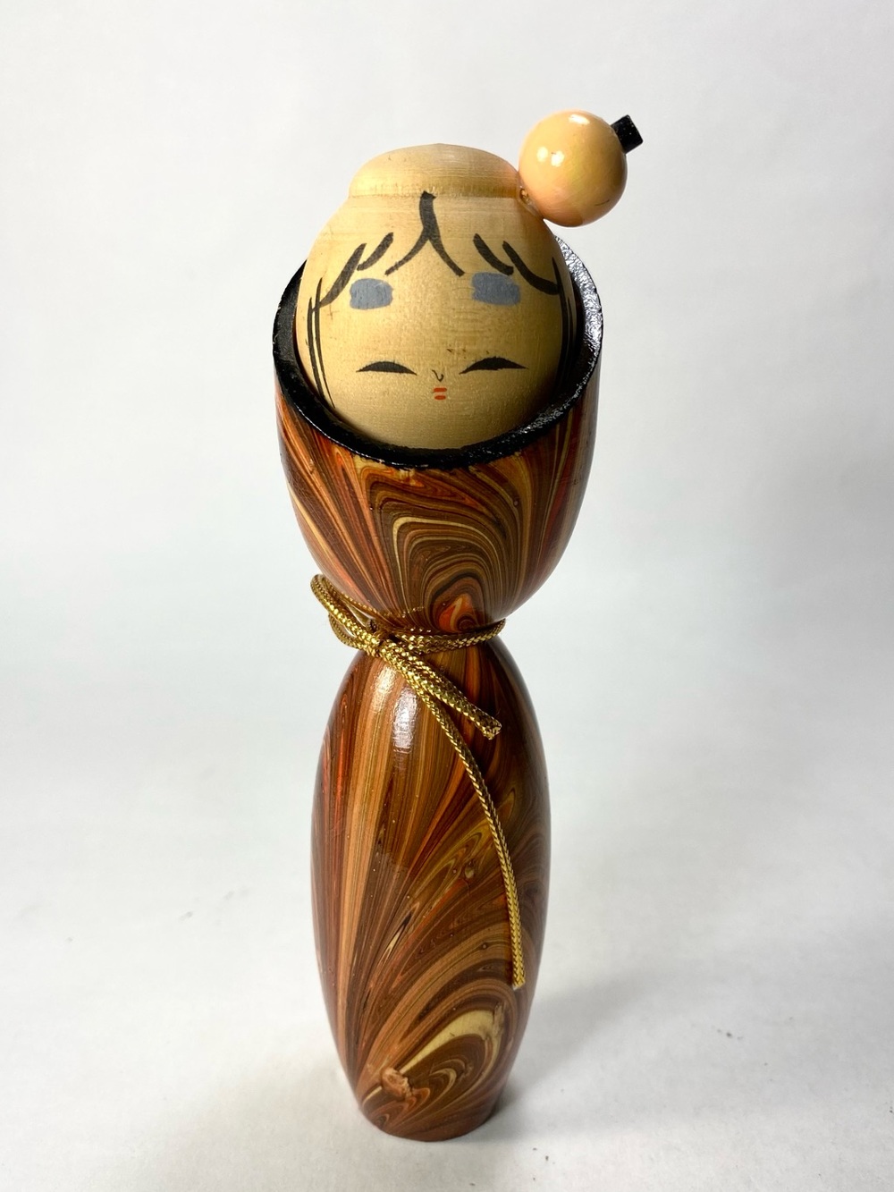 Hand-Painted Wooden Kokeshi Doll in Swirled Brown and Cream